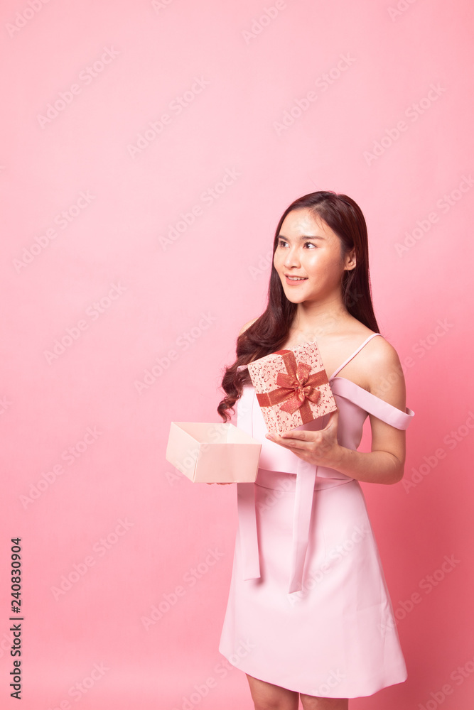 Young Asian woman open a gift box. Young Asian woman open a gift box.