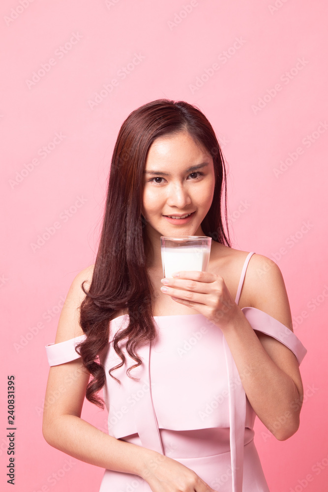 Healthy Young Asian woman drinking milk Healthy Young Asian woman drinking milk