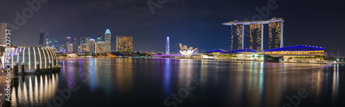 Panoramic view of Marina Bay Sands, Singapore flyer, buildings around Marina Bay in Singapore at night.