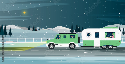 Caravan family travels during the snowy night