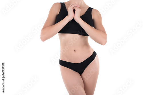 Well groomed female cropped body in black base underwear, isolated on white.