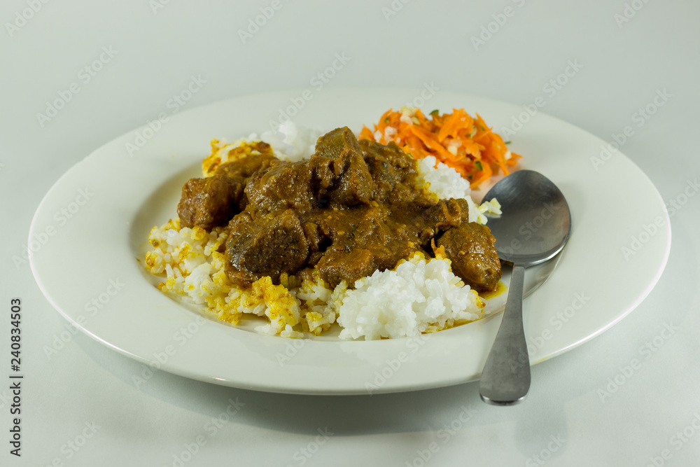 curry with rice and carrot salad on white plate curry with rice and carrot salad on white plate