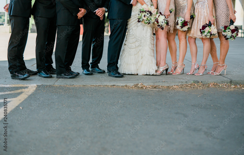 wedding party holding flowers in a row
