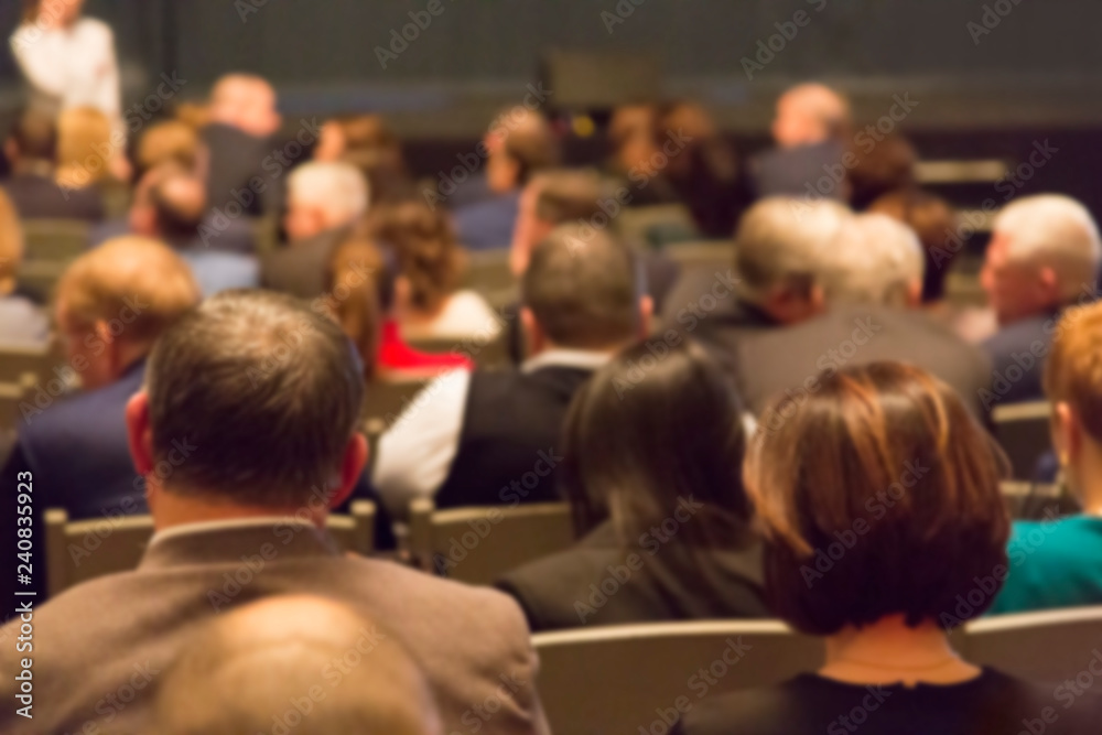 People in the theater auditorium during the performance. Blurred image