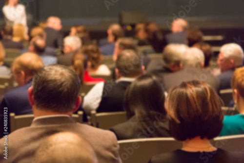 People in the theater auditorium during the performance. Blurred image