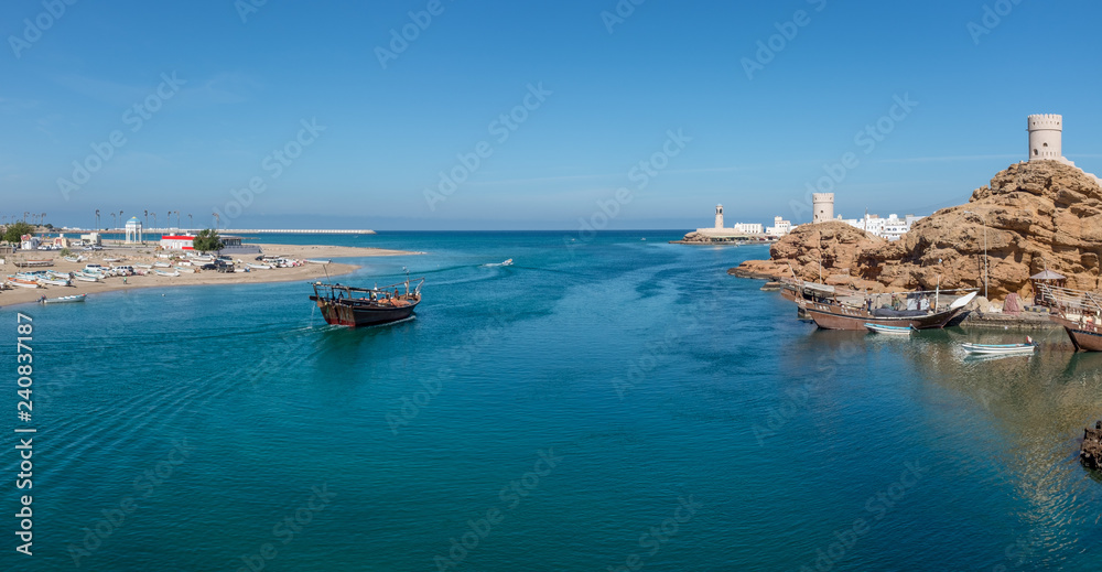 Fishing boat heading out of the harbour at Sur, Oman