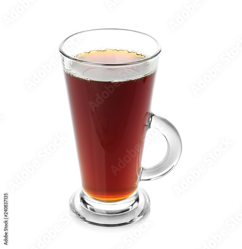 Glass cup of tasty aromatic tea on white background