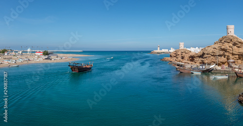 Fishing boat heading out of the harbour at Sur, Oman