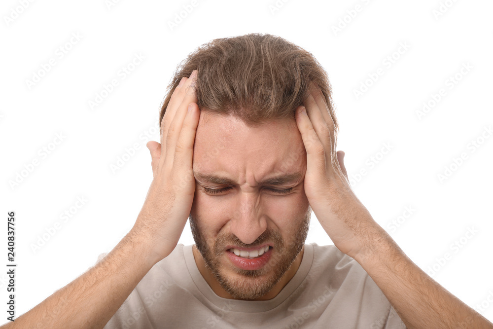 Young man suffering from headache on white background Young man suffering from headache on white background