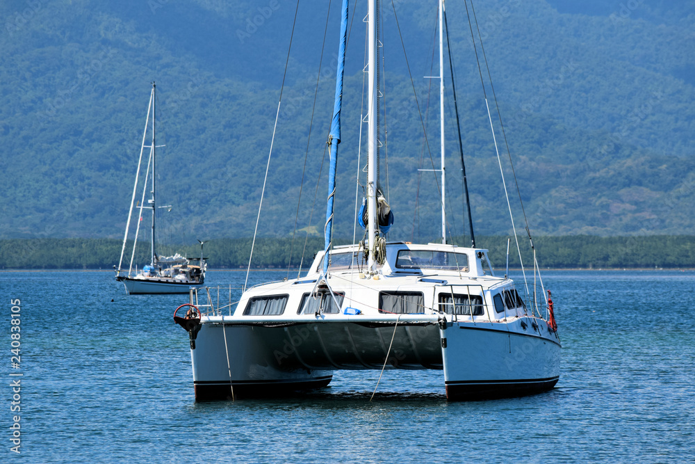 Fototapeta premium White catamaran moored in the bay. Philippines.