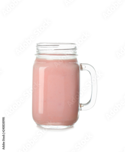 Mason jar of tasty milkshake on white background