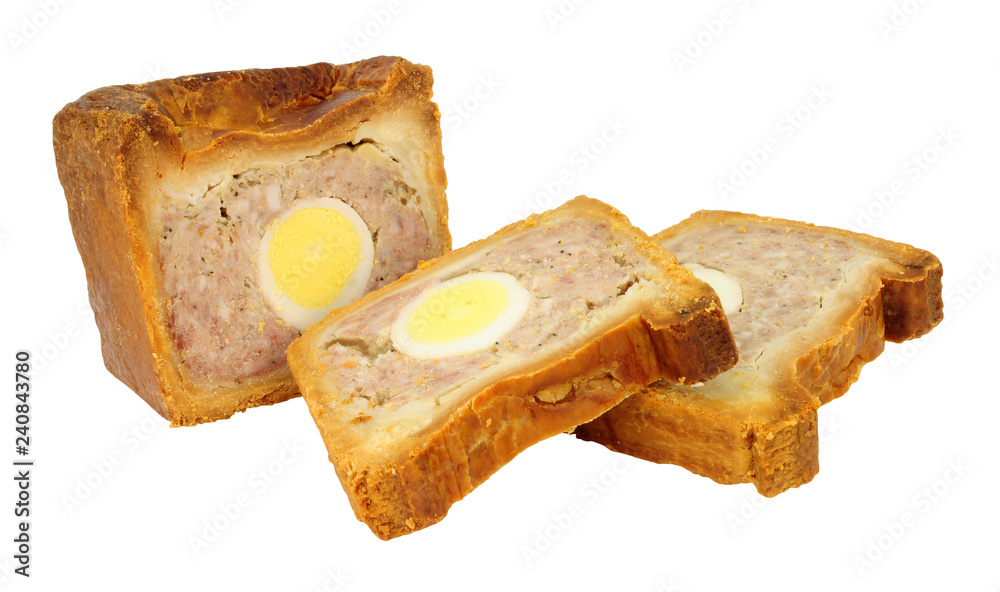 Traditional English savoury gala egg pork pie with crusty hot water pastry isolated on a white background