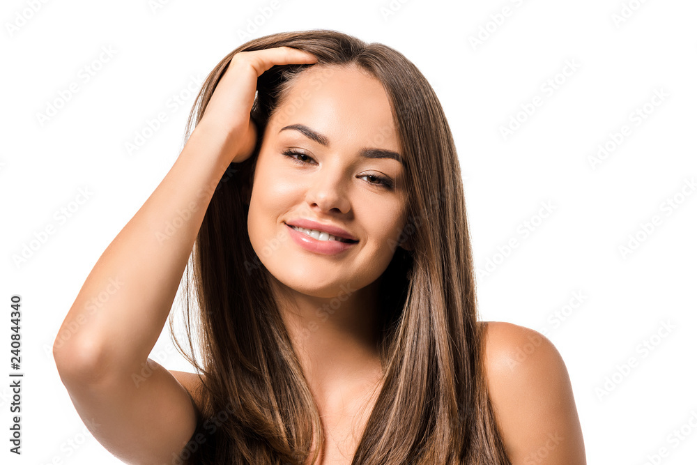 beautiful woman smiling, touching long brown hair and looking at camera isolated on white beautiful woman smiling, touching long brown hair and looking at camera isolated on white