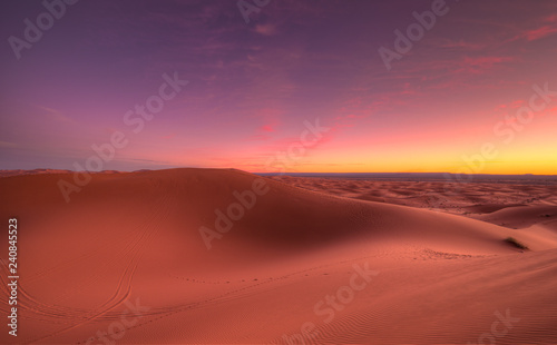 Amazing sunrise over the dunes Erg Chebbi in the Sahara desert near Merzouga  Morocco   Africa. Beautiful sand landscape with stunning sky