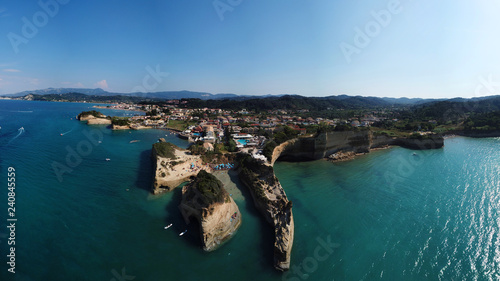 Aerial drone photo of iconic white rock steep cliff volcanic bay of Cape Drastis and Peroulades area with tropical deep turquoise clear sea, Corfu island, Ionian, Greece