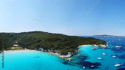Aerial drone panoramic photo of tropical caribbean bay with white sand beach and beautiful turquoise and sapphire clear sea © aerial-drone