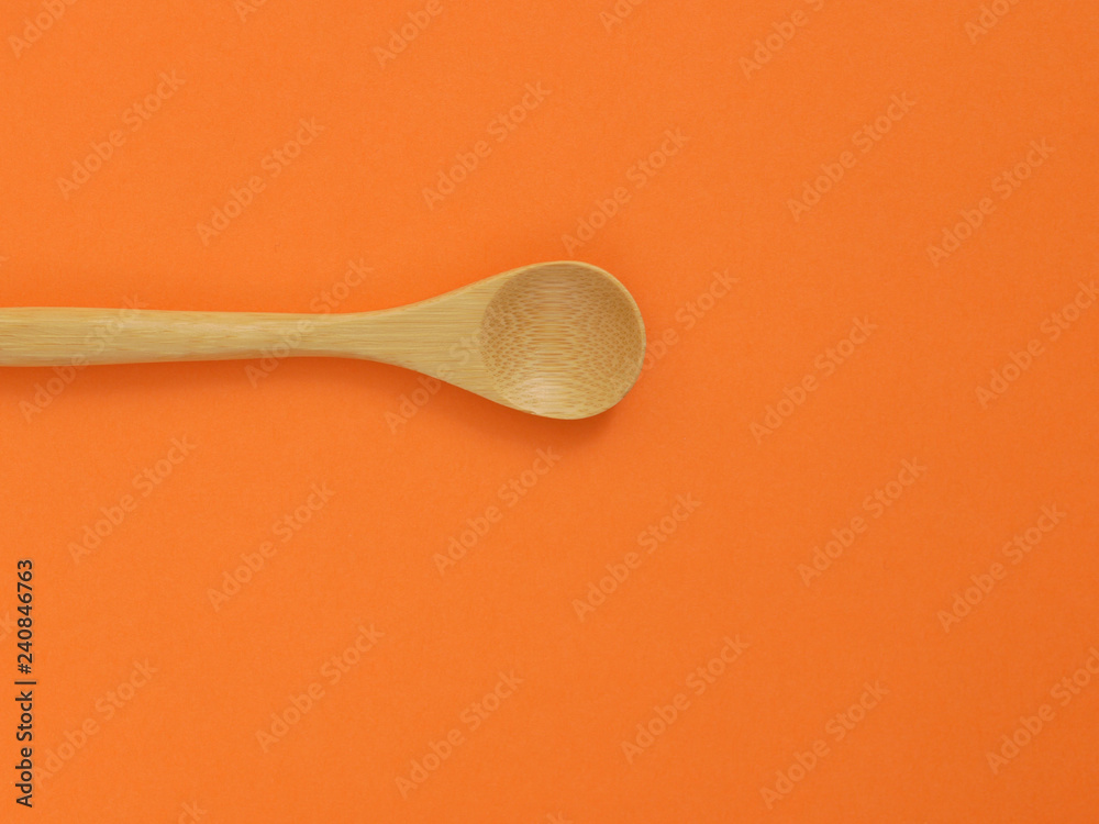 spoon on orange background spoon on orange background