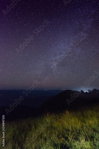 grass in the dark and star in the sky on top of the mountain at mon jong doi, Chiang mai, Thailand