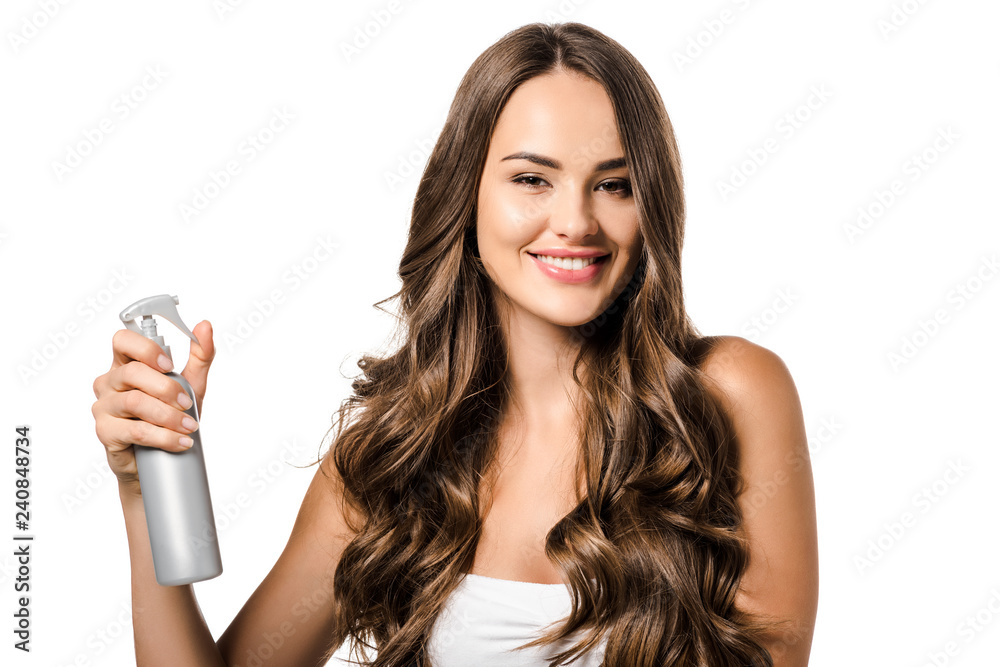 beautiful girl holding spray bottle, looking at camera and smiling isolated on white beautiful girl holding spray bottle, looking at camera and smiling isolated on white