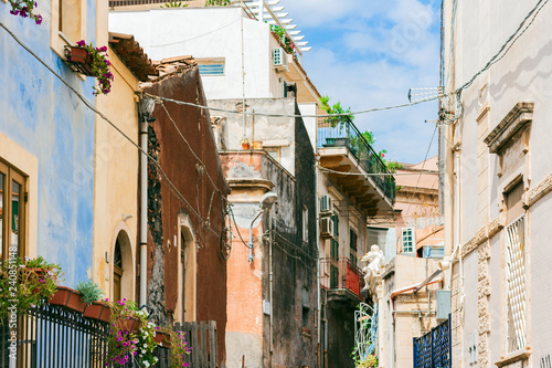 Fototapeta Naklejka Na Ścianę i Meble -  Travel to Italy -  historical street of Catania, Sicily, facade of ancient buildings