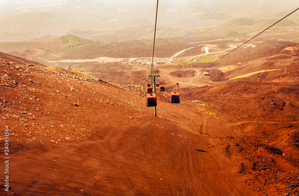 Obraz premium Elevators lift tourists to Mount Etna at sunrise, Catania, Sicily, Italy