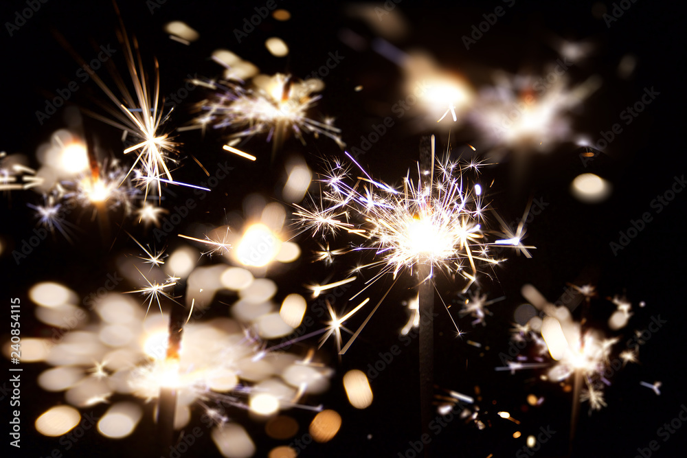 Sparks of sparkler. Holiday atmosphere. New Year.