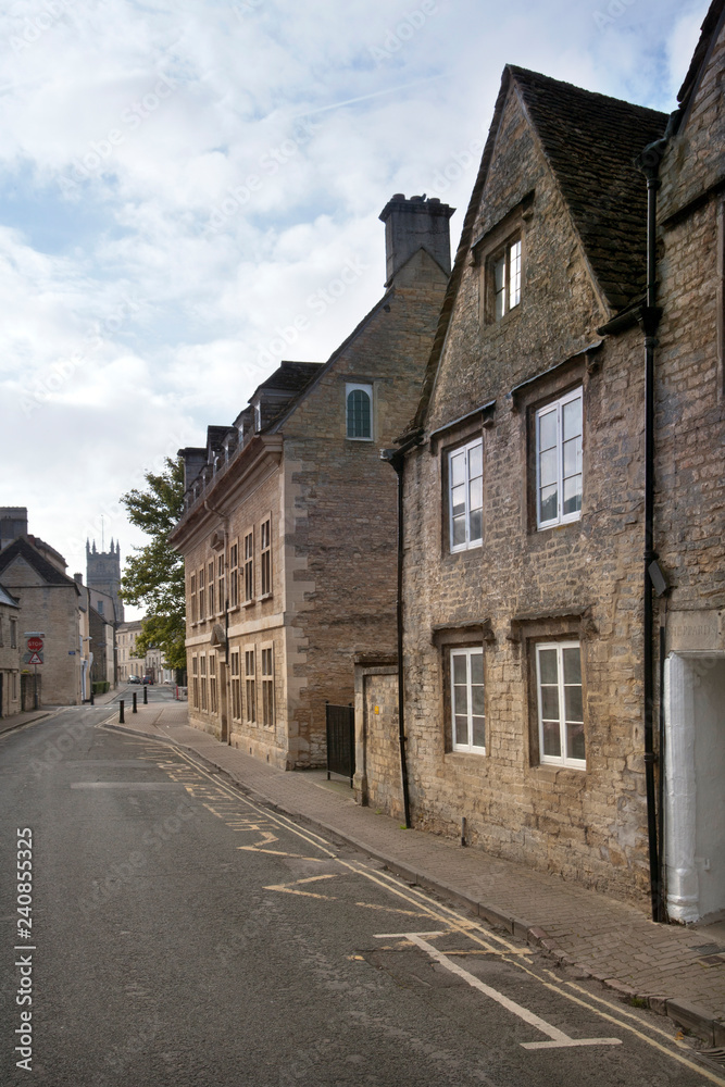 Early morning sunshine on a picturesque street in Cirencester, Gloucestershire, UK