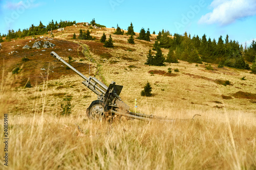 Old cannon from world war in beautiful mountain landscape in Mincol, Slovakia photo