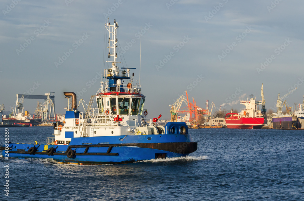 TUG BOAT - Ship against the background of port quays in Gdynia
