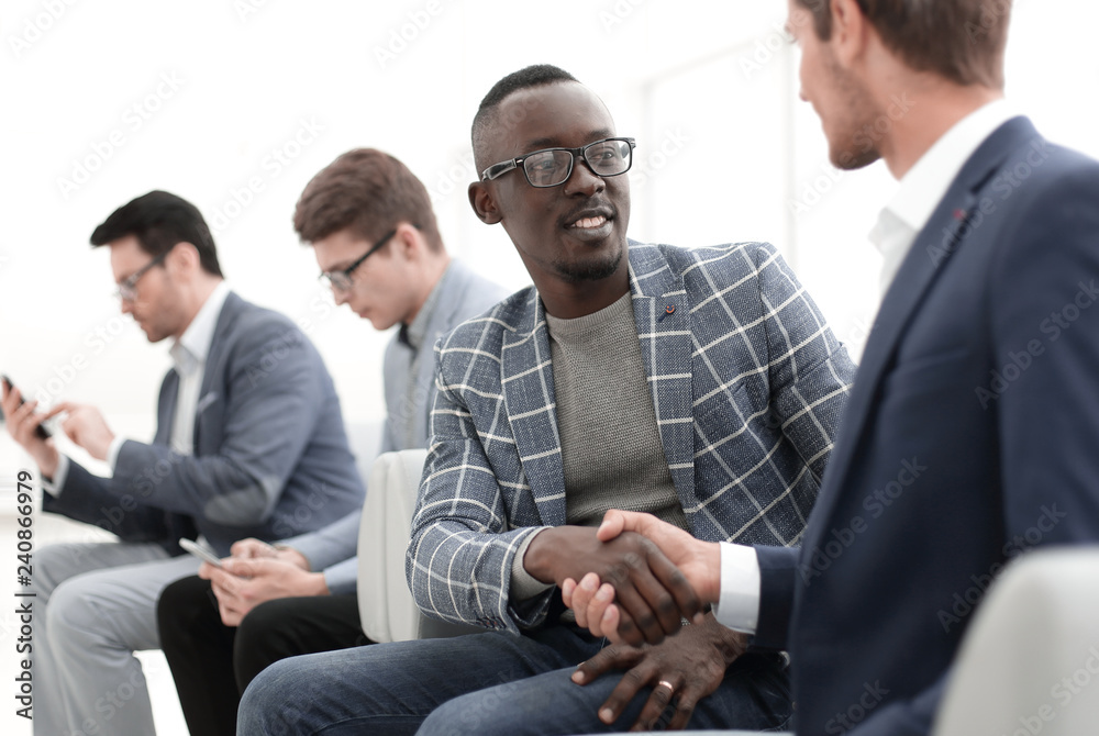 handshake business people sitting in the office handshake business people sitting in the office