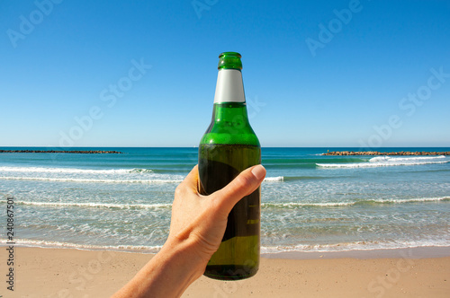 bottle of beer on the background of the sea