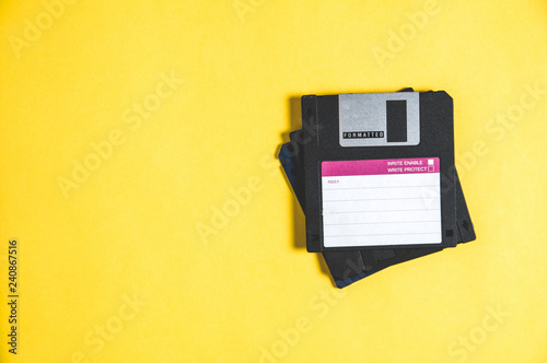Bilde på lerret Old floppy disks for computer on yellow background