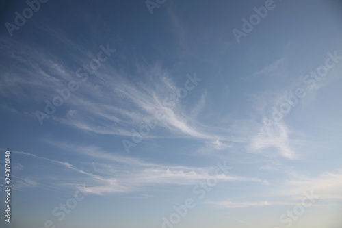 Natural light colored clouds and sky. Beautiful background of air space in the blue sky. The best image of heaven in the autumn clouds of natural background.