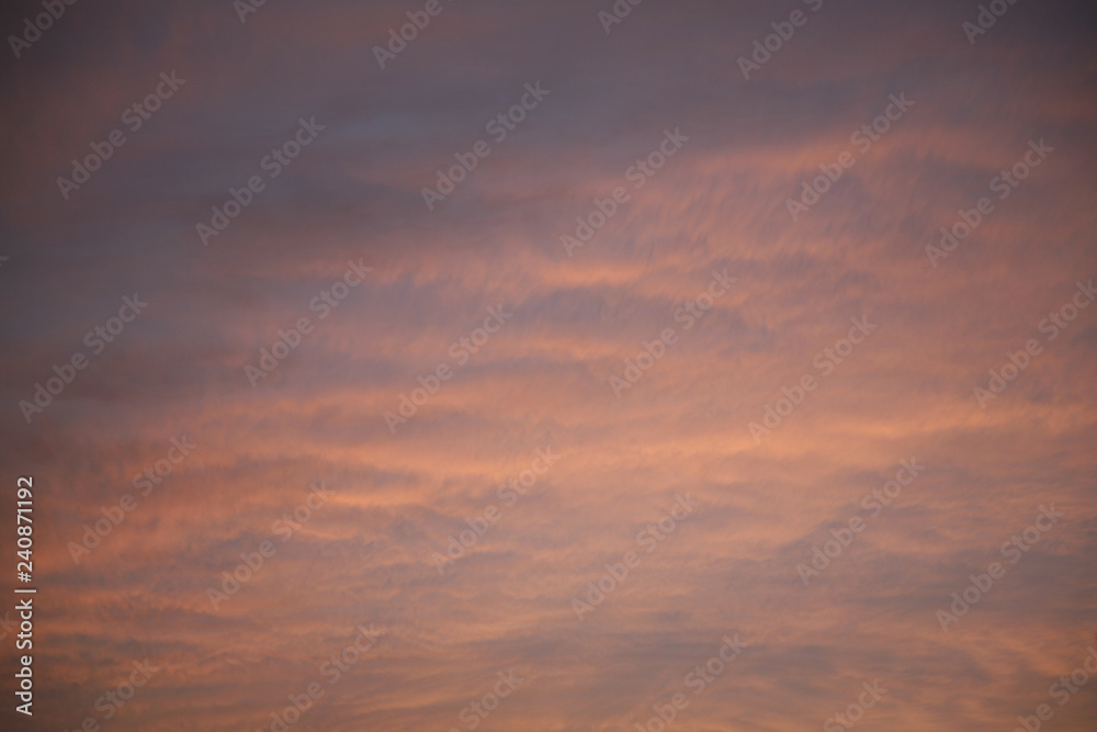 TSky clouds as the bhe sun  rays illuminate the sky with clouds. We see the background of the sky of natural color as in the picture. This image of a beautiful sky and white clouds pleases all people.