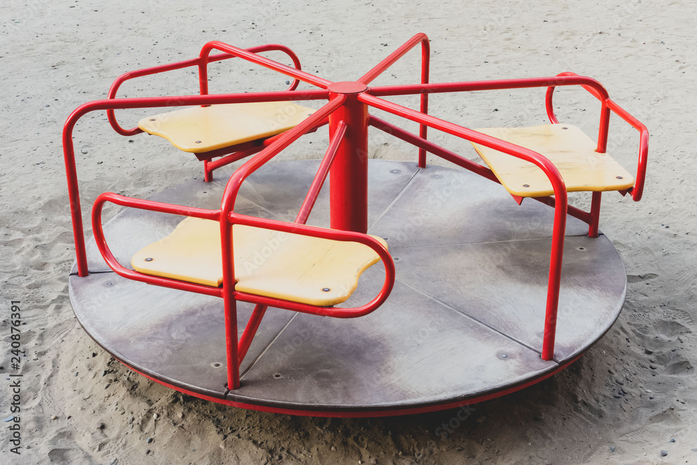 red and yellow carousel. The concept of childhood, parenting, games. red and yellow carousel. The concept of childhood, parenting, games.