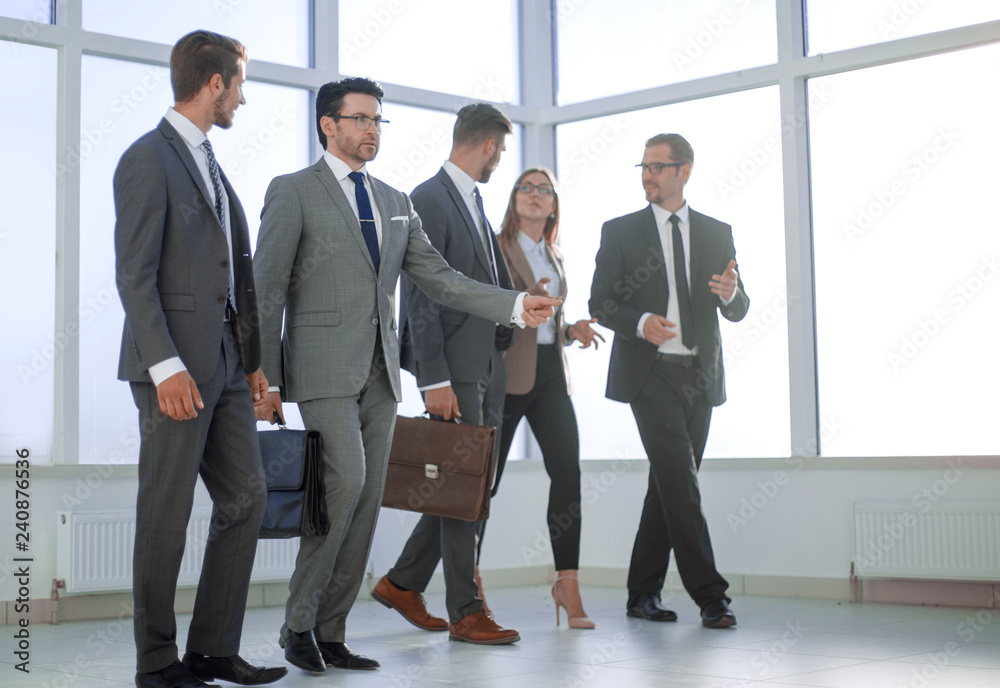 Businesspeople walking in the office background. Businesspeople walking in the office background.