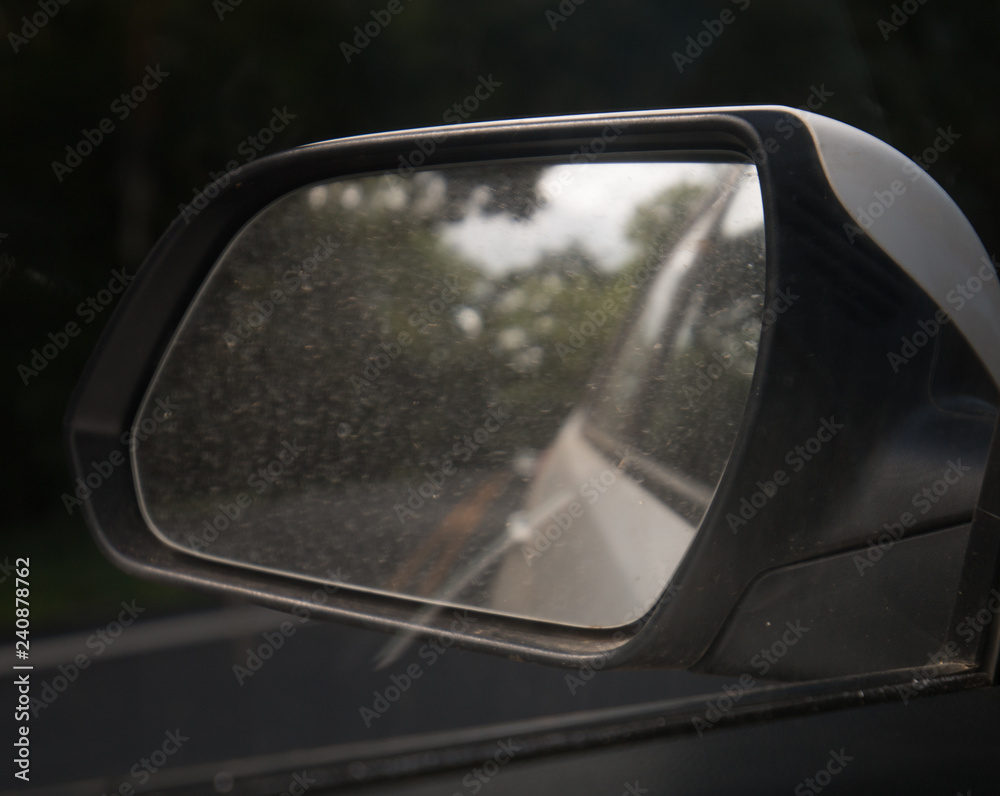 driving rearview mirror white car dark background