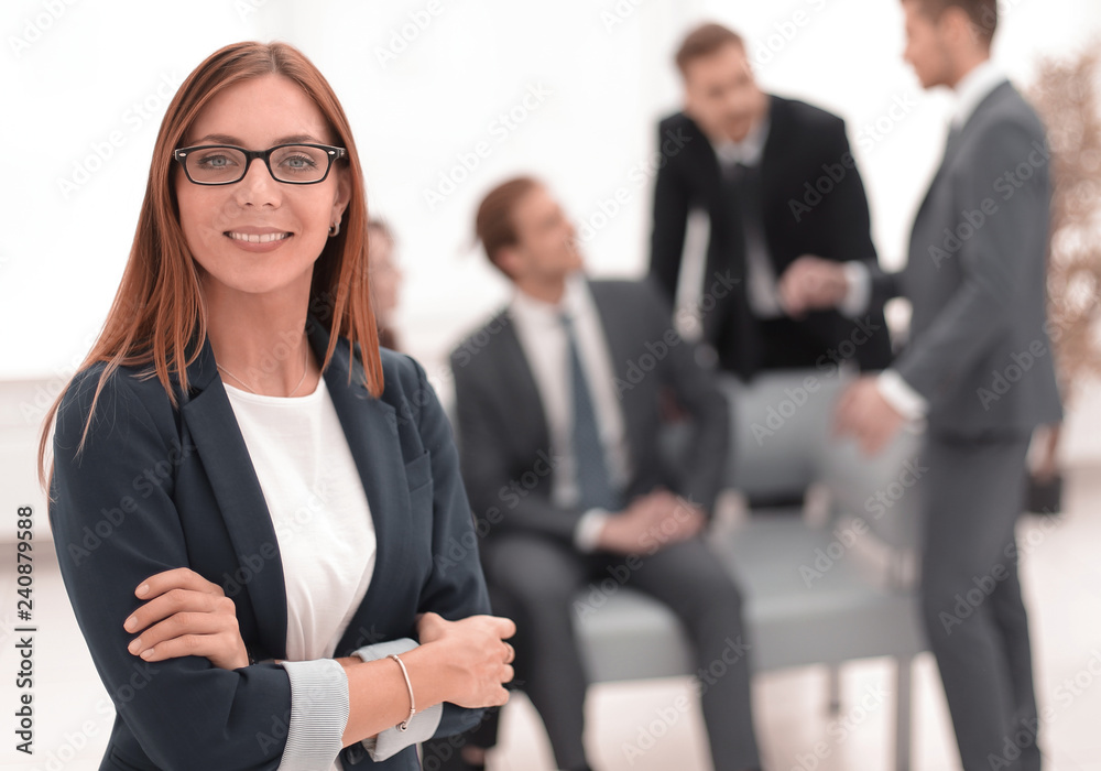 business woman standing with arms folded business woman standing with arms folded