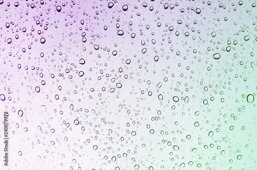Colour gradient rain drops on window