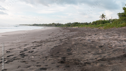 dark beach with clouds and fog