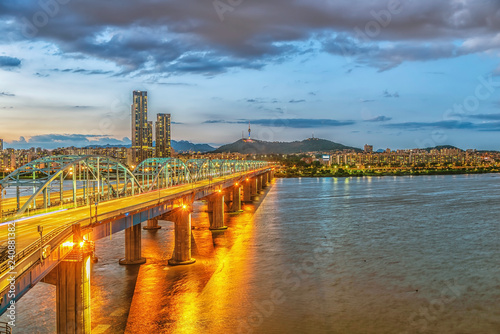 Seoul skyline at Dongjak Bridge and Han River in Seoul, South Korea photo