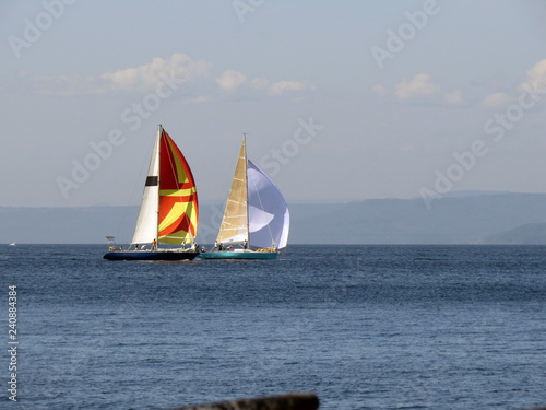 Two yachts sailing on the sea