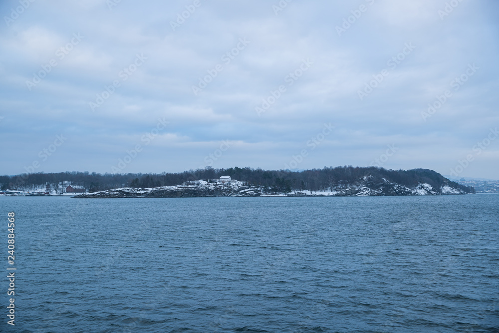 Overlooking the coast of the islands around Oslo Norway over the winter overlooking the sea and the Fjord