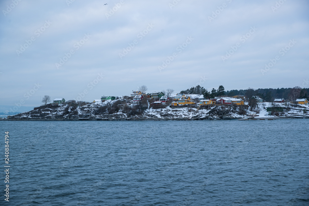 Cliffs on the islands around Oslo Norway over the winter overlooking the sea and the Fjord on horizont