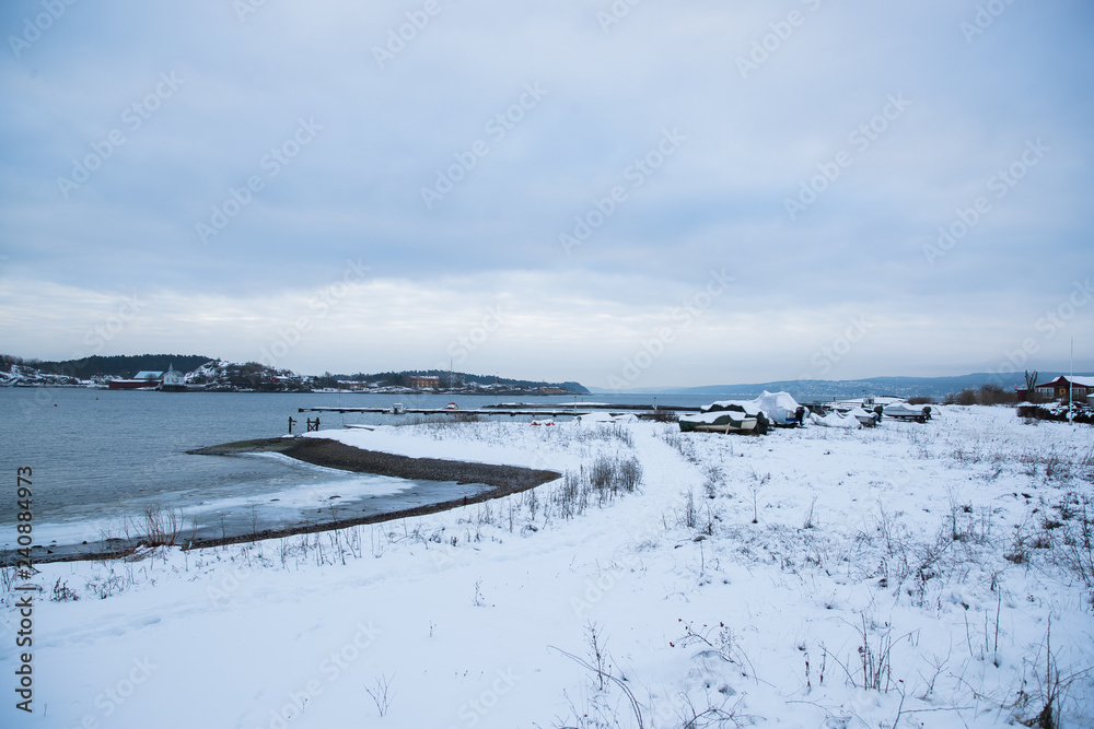 Overlooking the coast of the islands around Oslo Norway over the winter overlooking the sea and the Fjord during day.