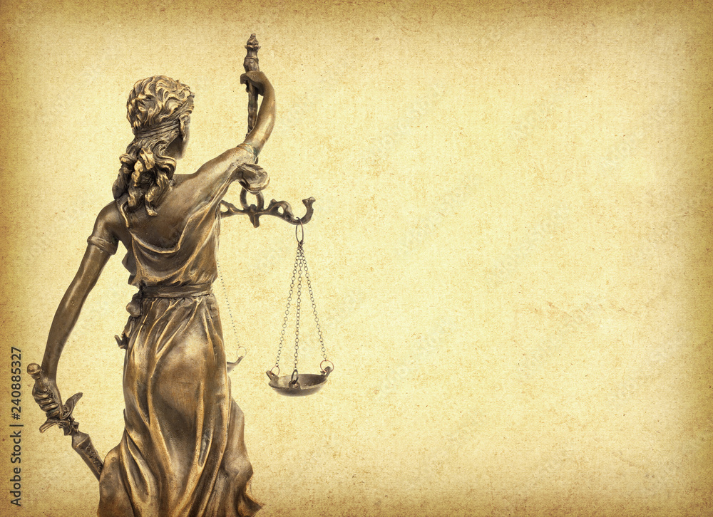 Statue of justice on old paper background, law concept Statue of justice on old paper background, law concept