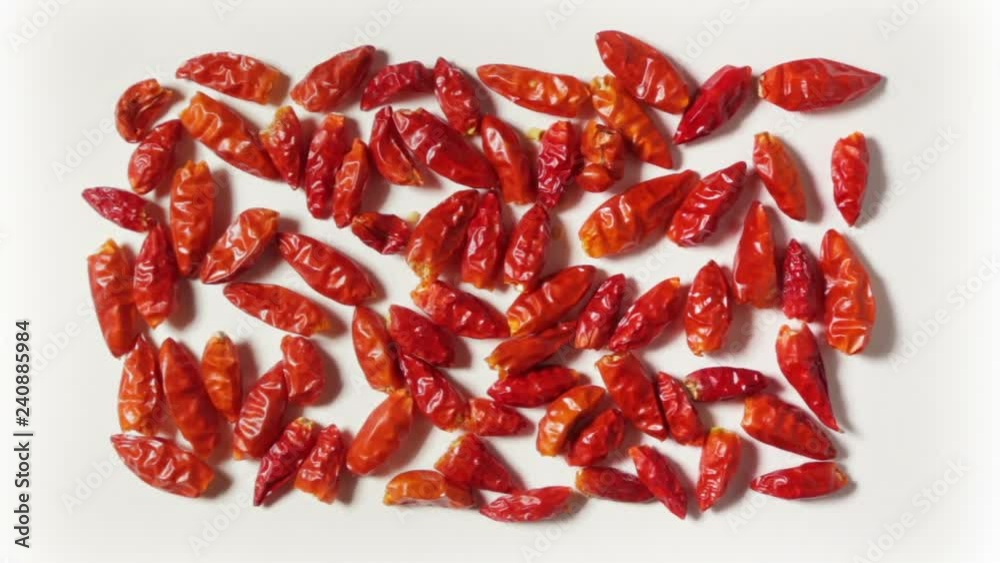 Some spicy red peppers, grouped in rectangular shape on a white plane, in zoom-in. Some spicy red peppers, grouped in rectangular shape on a white plane, in zoom-in.
