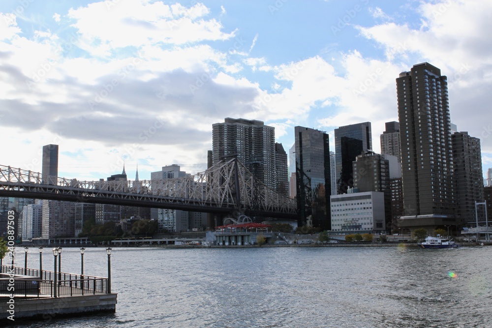 Fototapeta premium The Queensboro Bridge, also known as the 59th Street Bridge - officially the Ed Koch Queensboro Bridge, is a cantilever bridge over East River in New York. This is unique view from special location.
