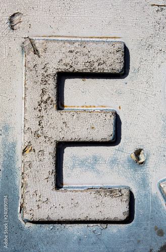 Written Wording in Distressed State Typography Found Letter E