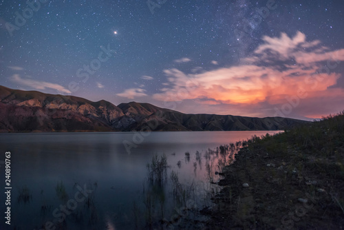 Fototapeta Naklejka Na Ścianę i Meble -  Mountains and lake in the starry night. Beautiful night landscape..